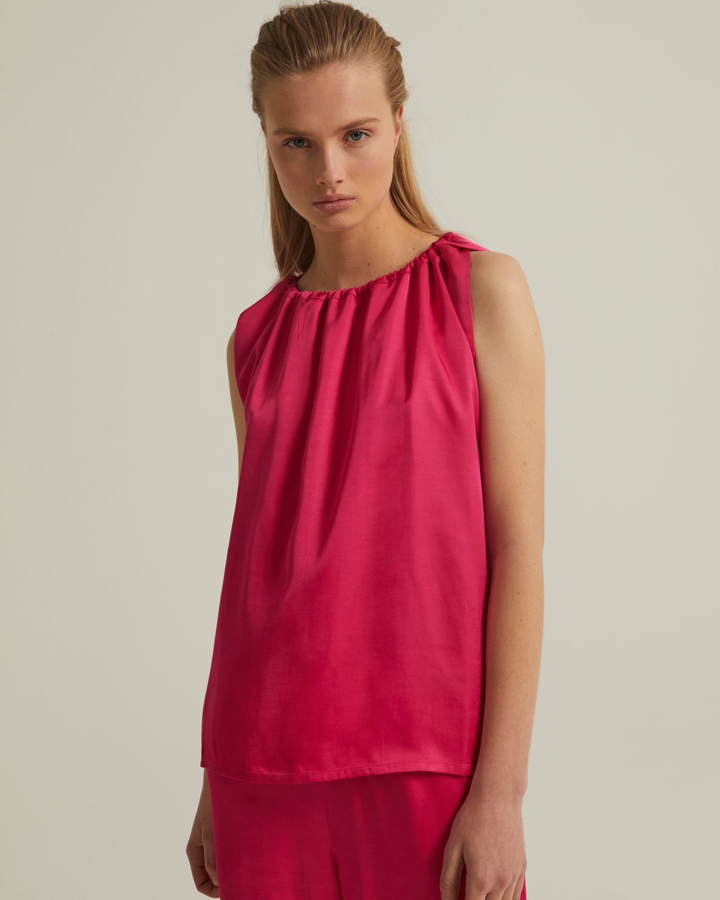 Sleeveless top with adjustable satin neckline